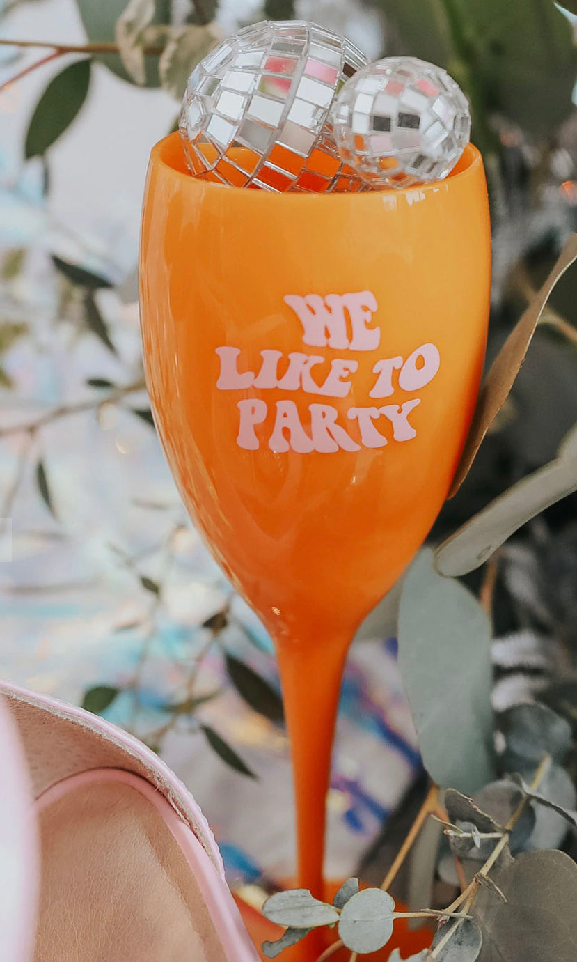 WE LIKE TO PARTY CHAMPAGNE GLASS