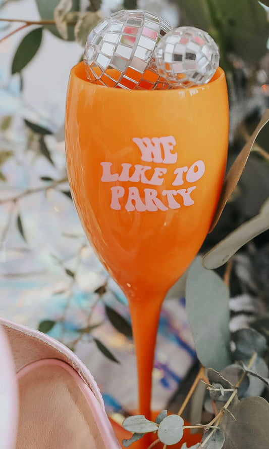 WE LIKE TO PARTY CHAMPAGNE GLASS
